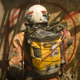 Wearing an exosuit to guard against the elements, Finch (Tom Hanks) stands before a plywood wall, spray painting a symbol of some sort.